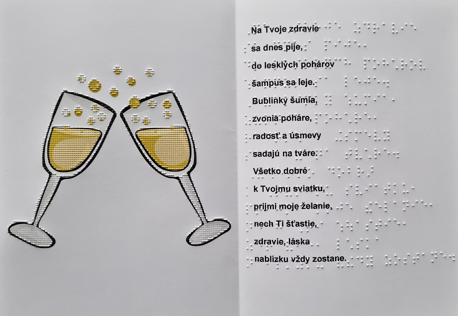 Fotografia pohľadnice, na ľavej strane je farebný obrázok pohárikov s bublinkovým nápojom, na pravej strane text priania v braili a čiernotlači.